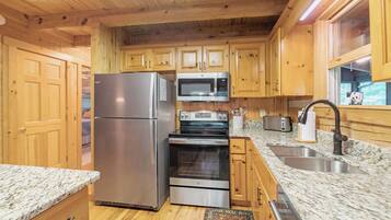 Mini-fridge, dishwasher, coffee/tea maker, cookware/dishes/utensils