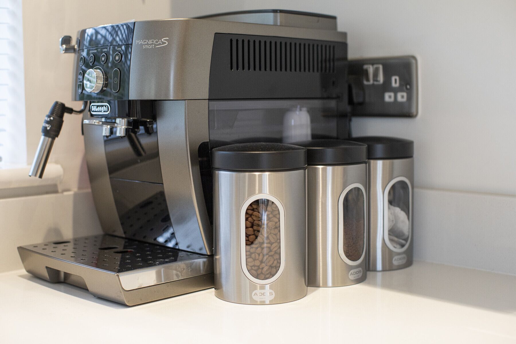 A coffee machine with a digital display and a coffee grinder.
