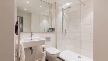 Shower, hair dryer, towels, shampoo