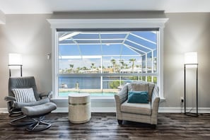 TV, books - Outdoor Kitchen, Heated Pool, - Villa Bay Vista - Roelens Vacations (Cape Coral)