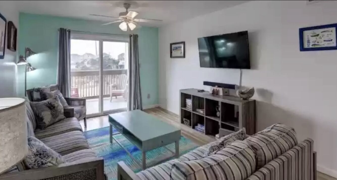 Cozy 2 bedroom condo on the sound side/water views Walking distance to the beach