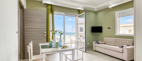 Family Apartment, 1 Bedroom, Balcony, Sea Facing (Corallo House 200m From The Sea) | Living area | 21-inch flat-screen TV with cable channels