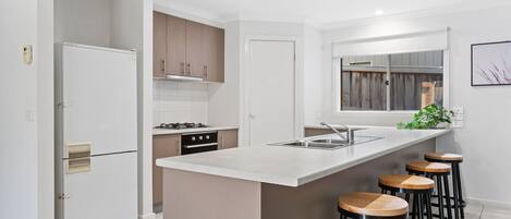 Fridge, coffee/tea maker, toaster, cookware/dishes/utensils