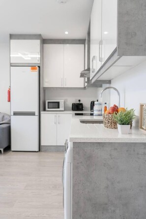 Apartment, 2 Queen Beds | Private kitchen | Fridge, microwave, oven, stovetop