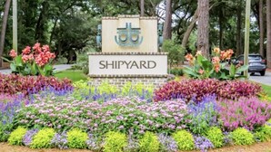 A sign with the name 'SHIPYARD' surrounded by a colorful flower garden. - Sunset Rentals | Shipmaster 1203 (Hilton Head Island)