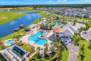 A resort with multiple swimming pools, a water park, and a marina.