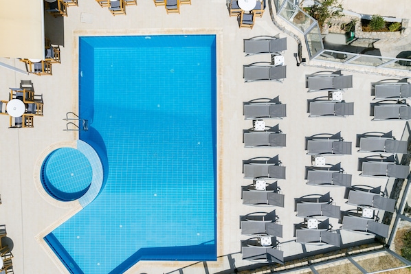 Seasonal outdoor pool, pool umbrellas, pool loungers