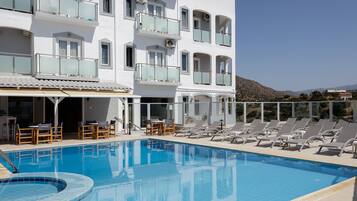 Seasonal outdoor pool, pool umbrellas, sun loungers