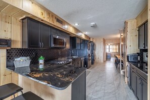 Fridge, microwave, oven, stovetop - Direct Oceanfront 4BR/4BA Beach House on 31st Street, Ocean City MD | Sleeps 13, Pet-Friendly, Beach Gear + Bikes Included | Midtown Ocean Views (Ocean City)