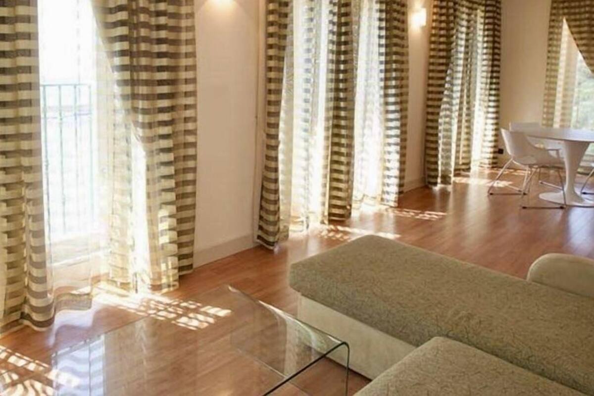 Luxury Suite | Living area | 32-inch flat-screen TV with satellite channels, TV