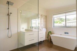 Bathtub, hair dryer, towels, soap
