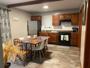 Fridge, microwave, stovetop, coffee/tea maker
