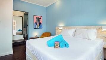 Suite junior, frente al océano | 1 habitación, ropa de cama de alta calidad y minibar