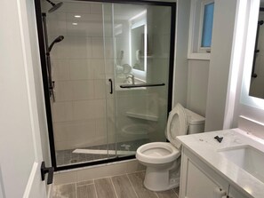 Combined shower/tub, hair dryer, towels, toilet paper