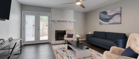 Smart TV, fireplace, books, smart speakers