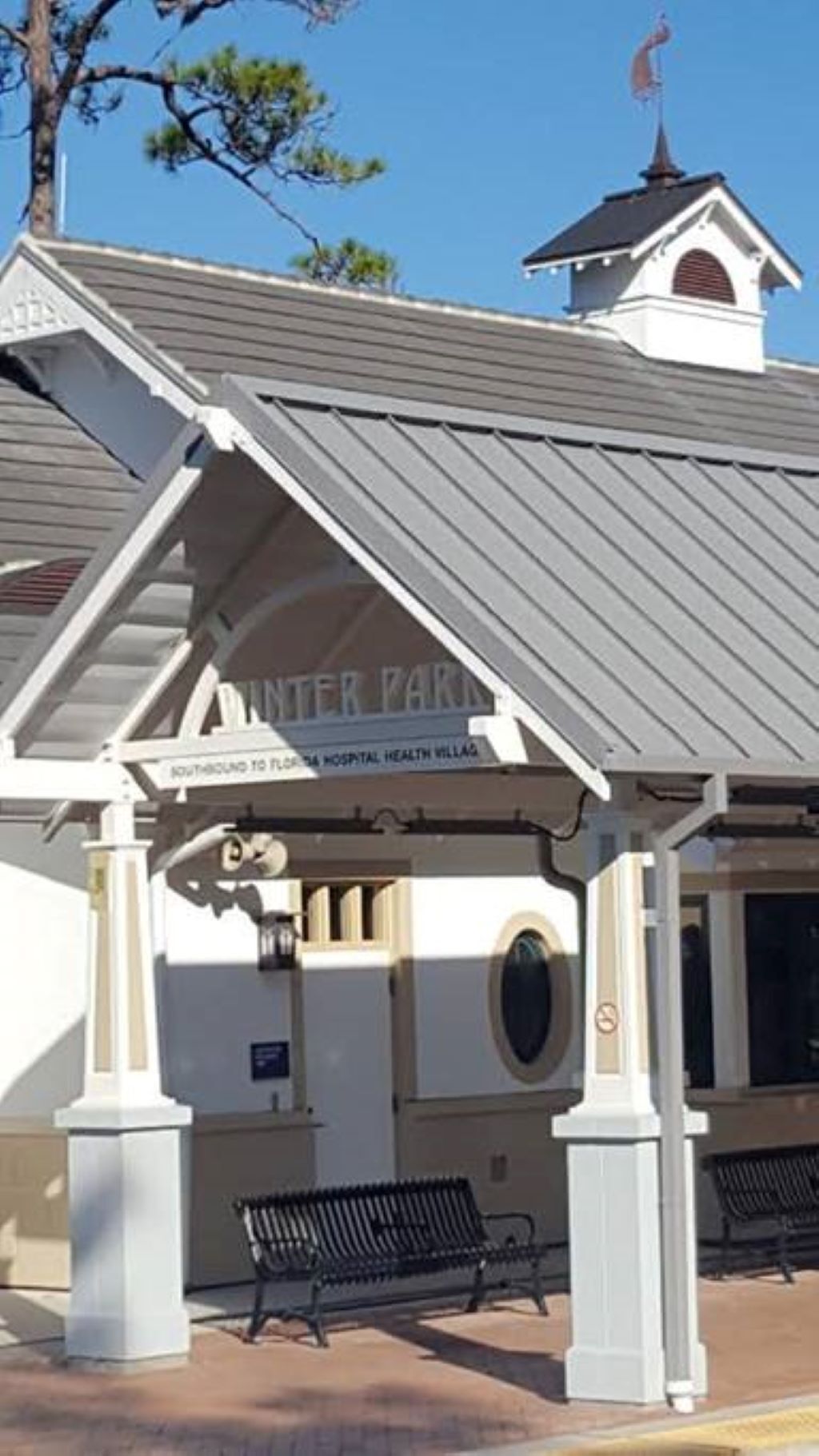 A building with a sign reading "INTER PARK" and "NORTHBOUND TO FLORIDA HOSPITAL HEALTH VILLAGE".