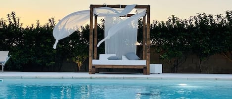 Seasonal outdoor pool, pool umbrellas, pool loungers