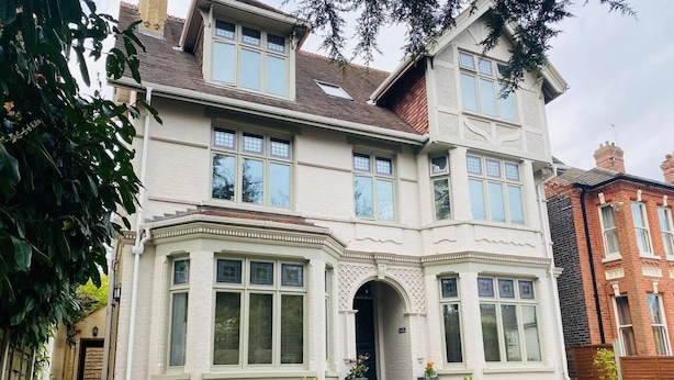 A two-story house with a bay window and a front entrance. - Luxury 2 bed Apartment Golden Triangle w Parking (Norwich)