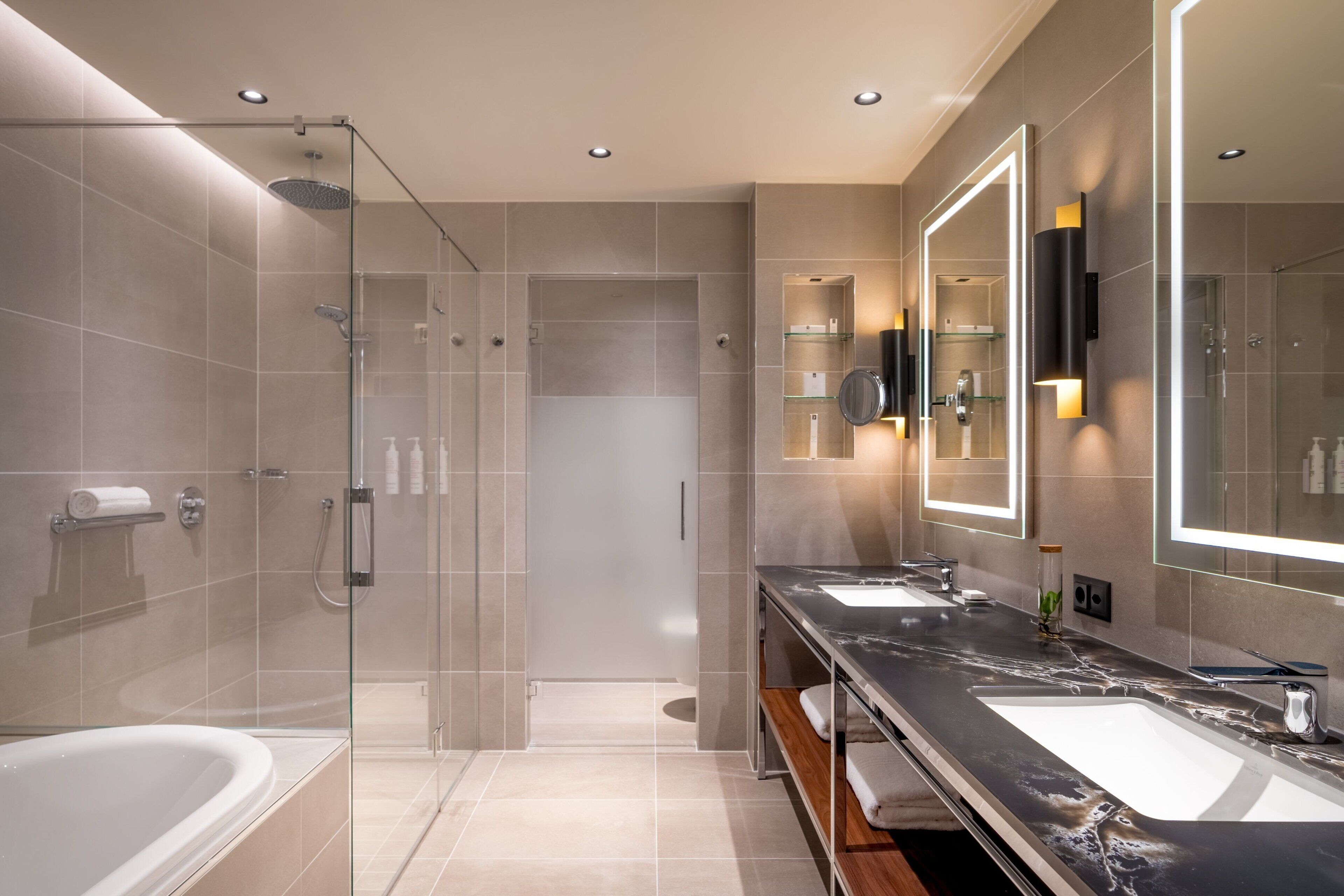 junior suite, 1 king bed, non smoking | bathroom | eco-friendly toiletries, hair dryer, slippers, towels