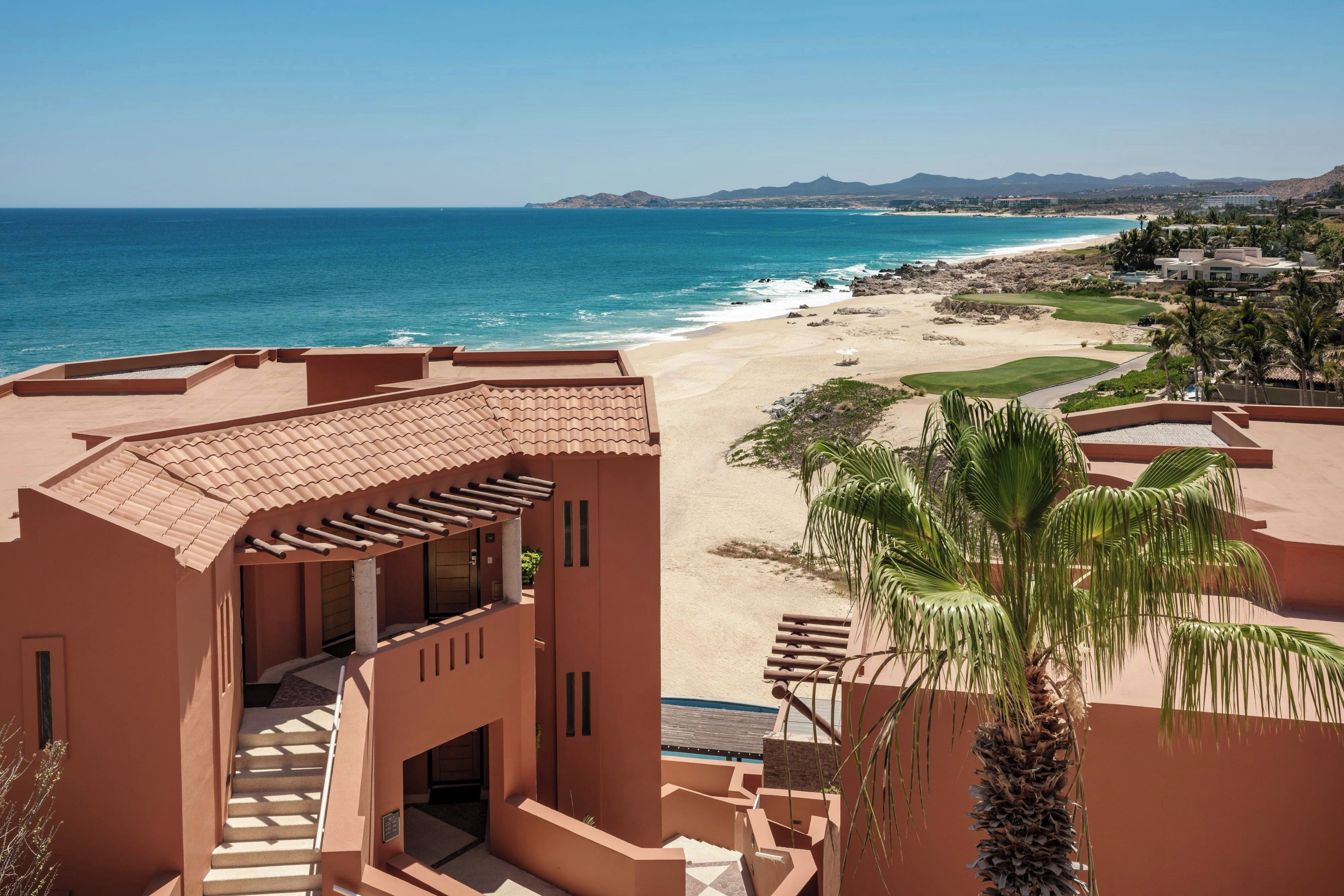 A coastal resort with a beach view, a pool area, and a golf course.