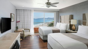 A hotel room with a bed, a desk, a chair, a TV, and a view of the ocean. - The Westin Los Cabos Resort Villas - Baja Point (San José del Cabo)