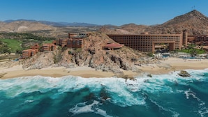 A coastal hotel with multiple buildings, a beach, and a mountainous backdrop. - The Westin Los Cabos Resort Villas - Baja Point (San José del Cabo)