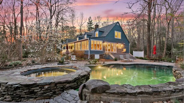 A two-story house with a large deck and a swimming pool. - Waterfront Paradise with Pool & Hot Tub plus 4 King Beds & 4 Full baths (Lexington Park)