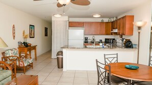 A compact living space with a kitchen, dining area, and a small seating area. - 🏖️SPECTACULAR - OCEANFRONT - GREAT LOCATION!!!🏖️ (Kailua-Kona)