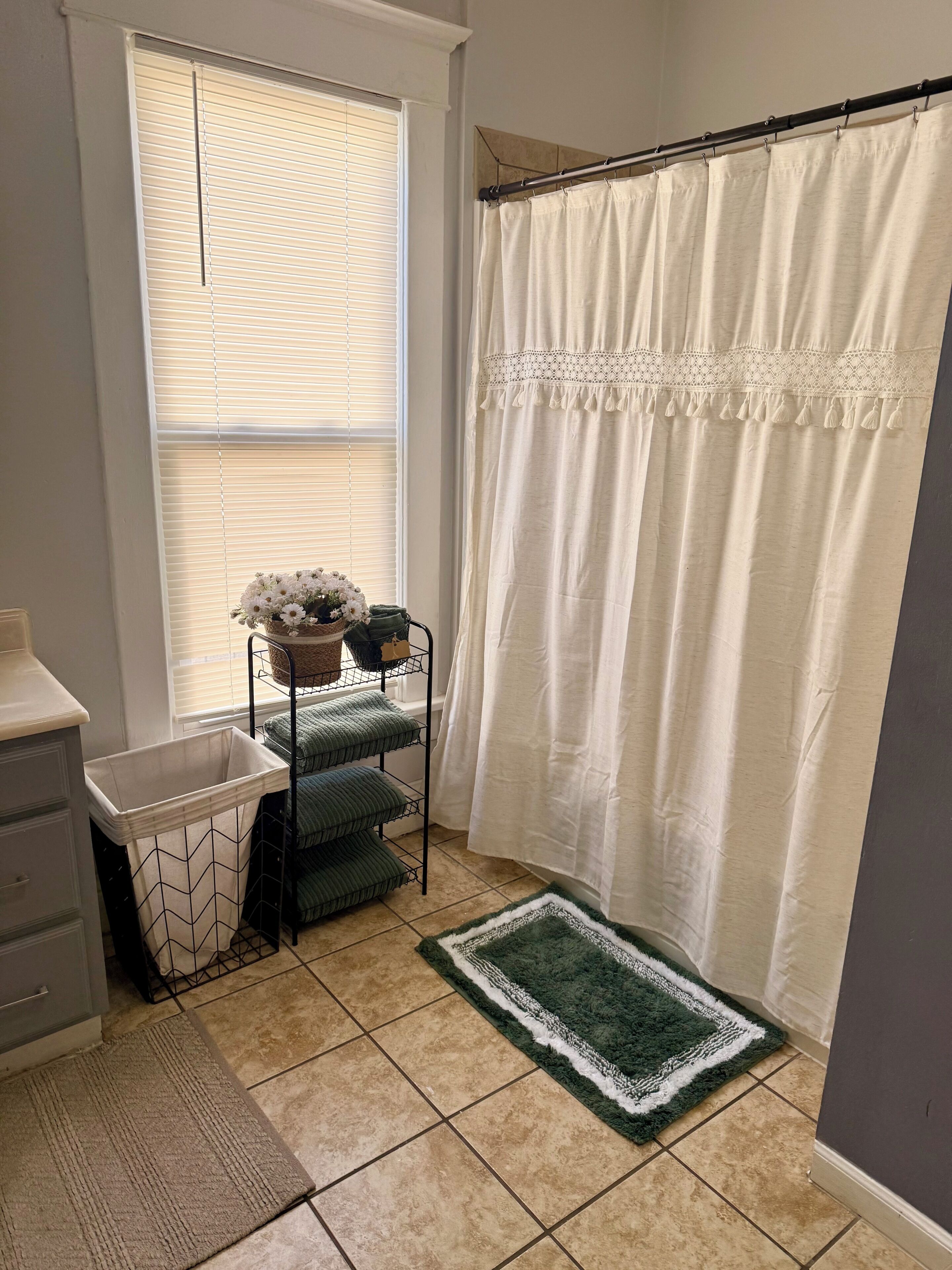 Combined shower/tub, hair dryer, towels, soap