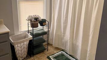 Combined shower/tub, hair dryer, towels, soap