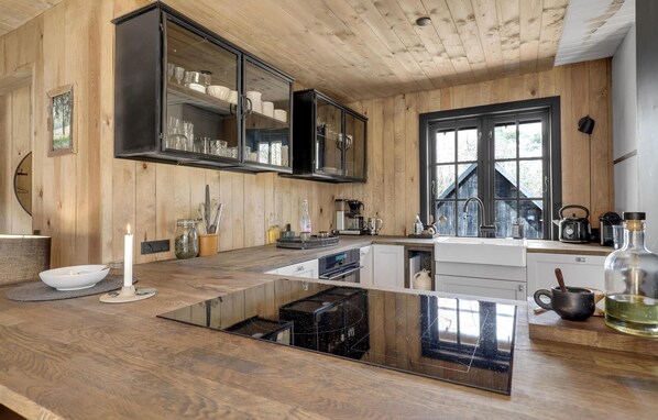 Fridge, dishwasher, coffee/tea maker, cookware/dishes/utensils