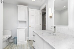 Bathtub, hair dryer, towels, soap