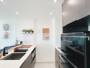 Fridge, microwave, stovetop, coffee/tea maker