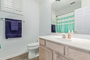 Combined shower/tub, hair dryer, towels, soap