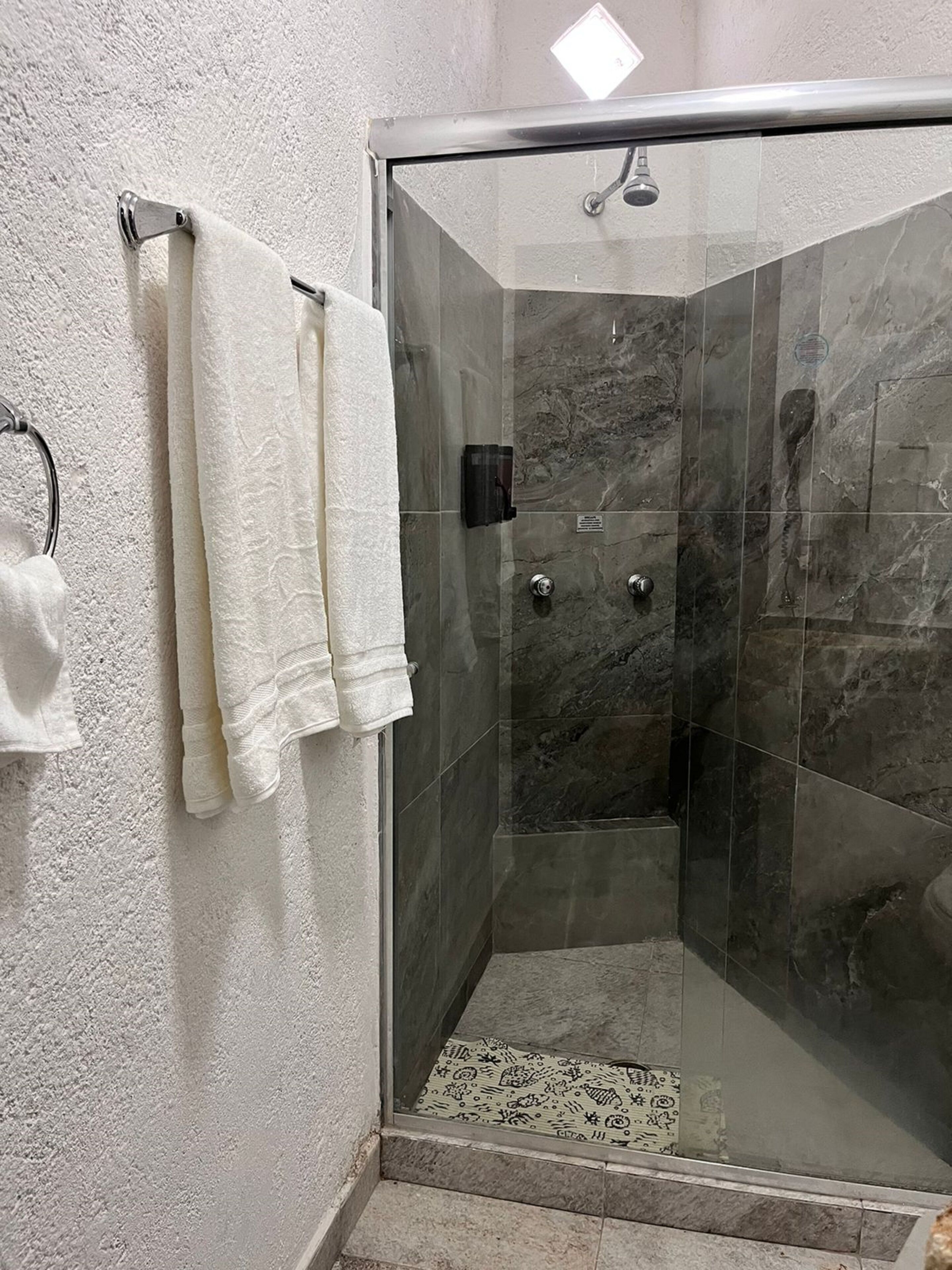classic quadruple room | bathroom | shower, towels