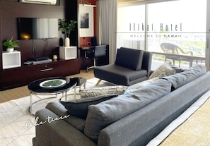 Relax in a stylish room with a large flat-screen TV, comfortable sofa, and a desk for work or relaxation.