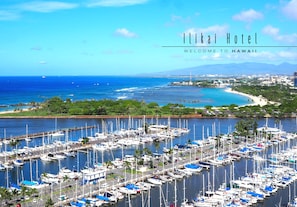 Enjoy stunning marina views from this coastal property, surrounded by lush greenery and a picturesque beach.