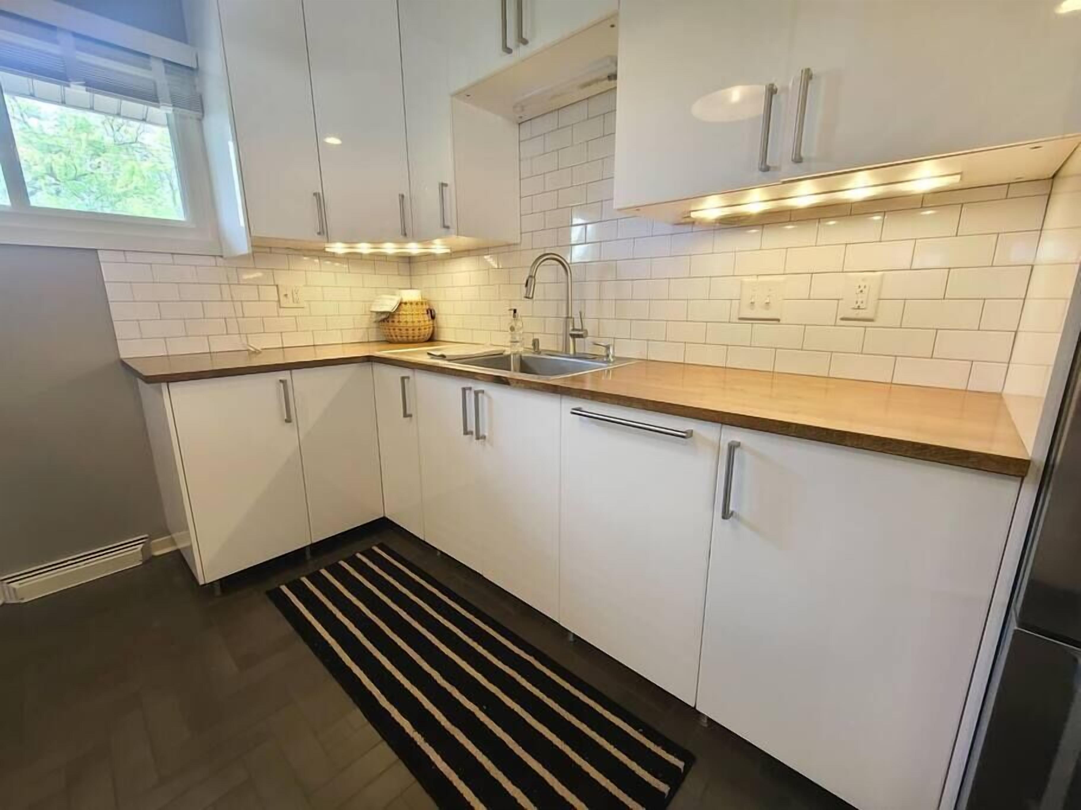 Lovely garden home located steps from the water.