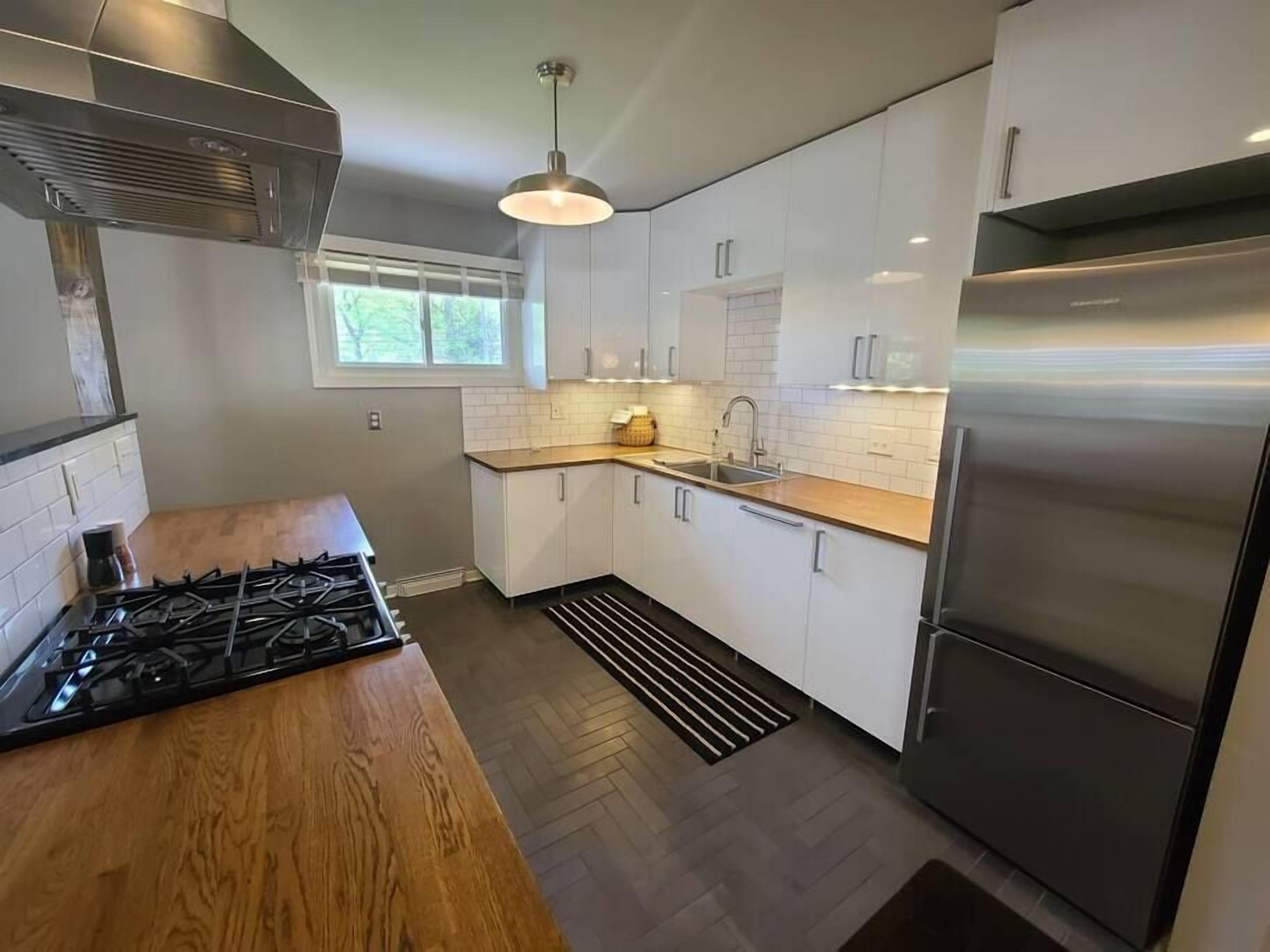 Lovely garden home located steps from the water.