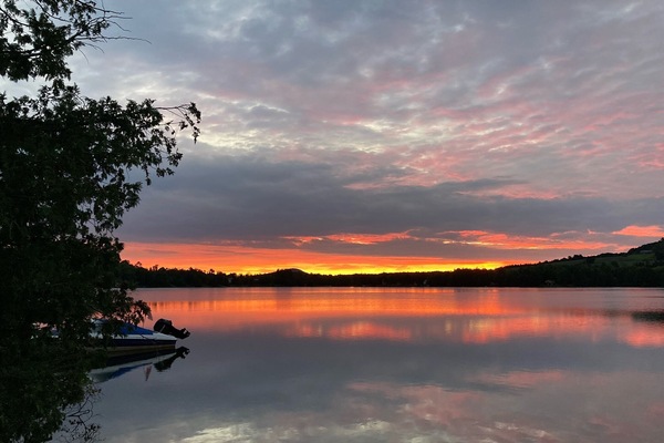 Sunrise from dock. Bring your coffee to the lake. Listen to the fish jumping.