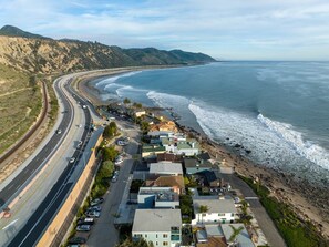 On the beach, sun-loungers, beach towels