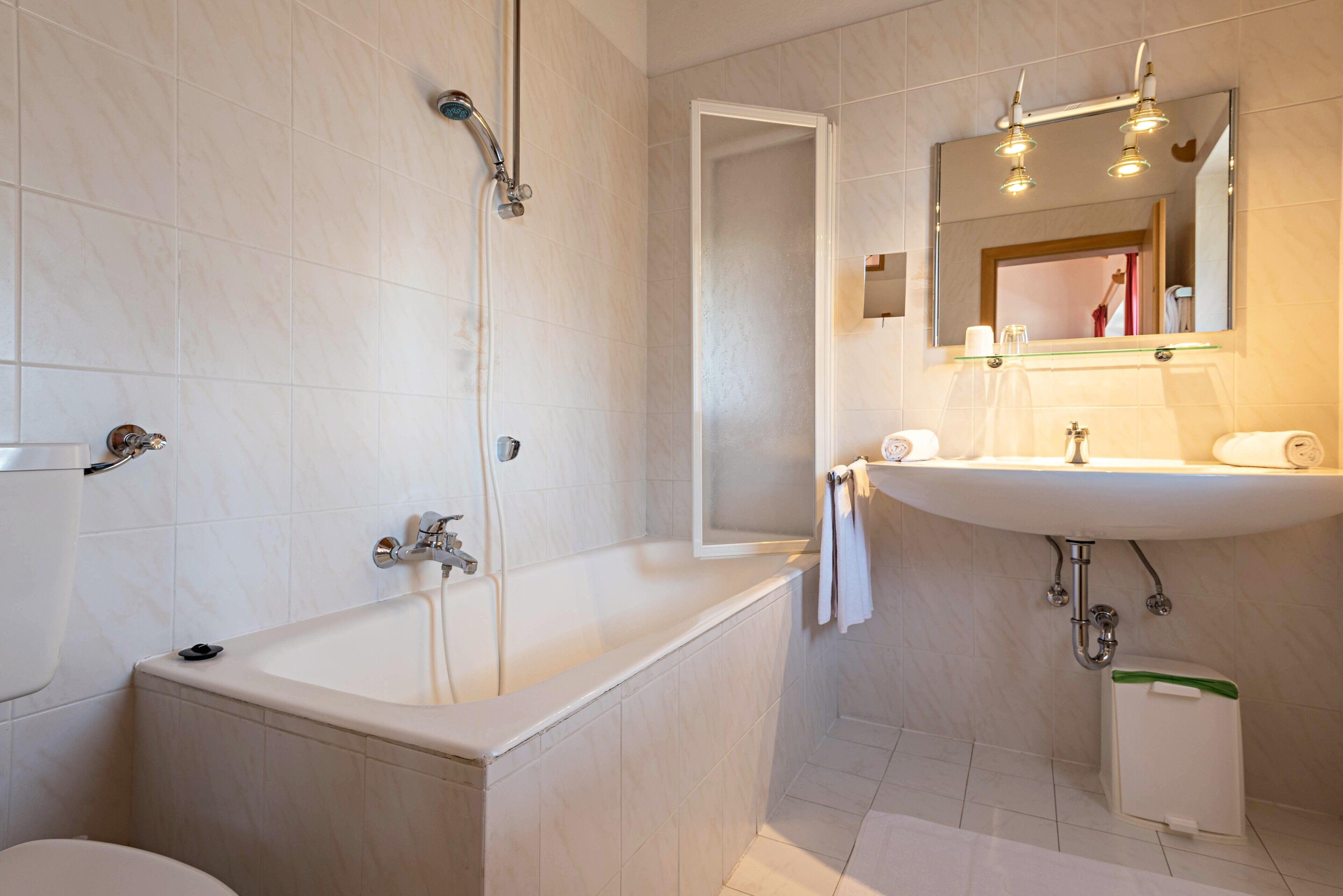 Bathtub, hair dryer, towels