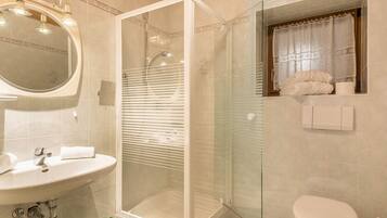 Bathtub, hair dryer, towels