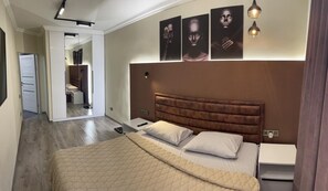 A bedroom with a large bed, bedside tables, a wardrobe, and a mirror. - Luxury2BED1Bath/central Yerevan Wi-Fi/2nd Floor/Demrtchyan40./ARMTRAVElTURE.com (YEREVAN)