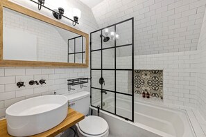 Combined shower/tub, hair dryer, towels, soap