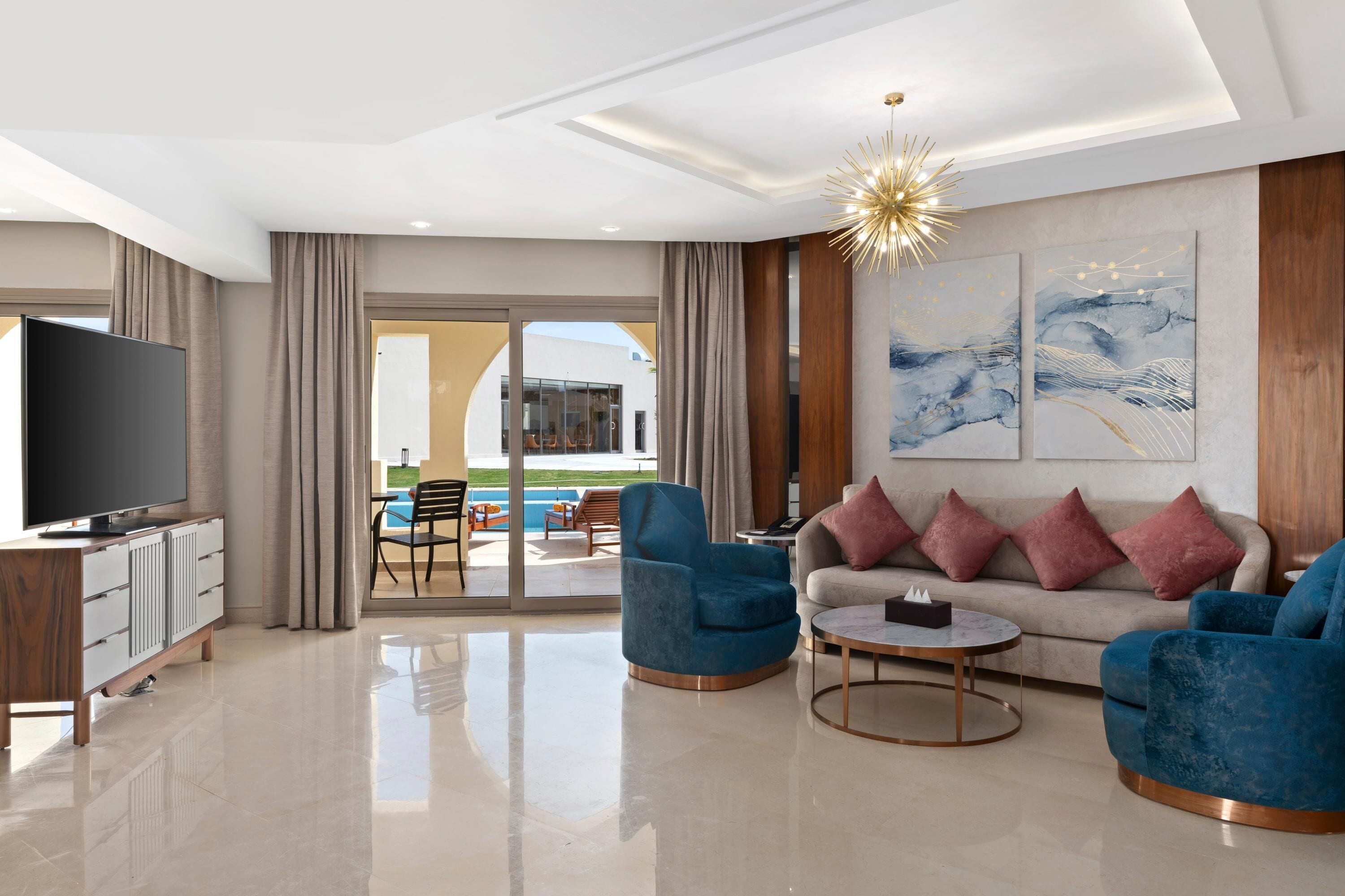 Lagoon Villa | Living area | 55-inch LCD TV with satellite channels, TV, fireplace