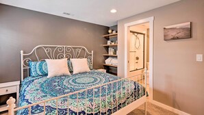 A bedroom with a bed, a nightstand, a dresser, and a shelf with towels. - Short Drive to State Parks: Herber City Apt (Heber City)