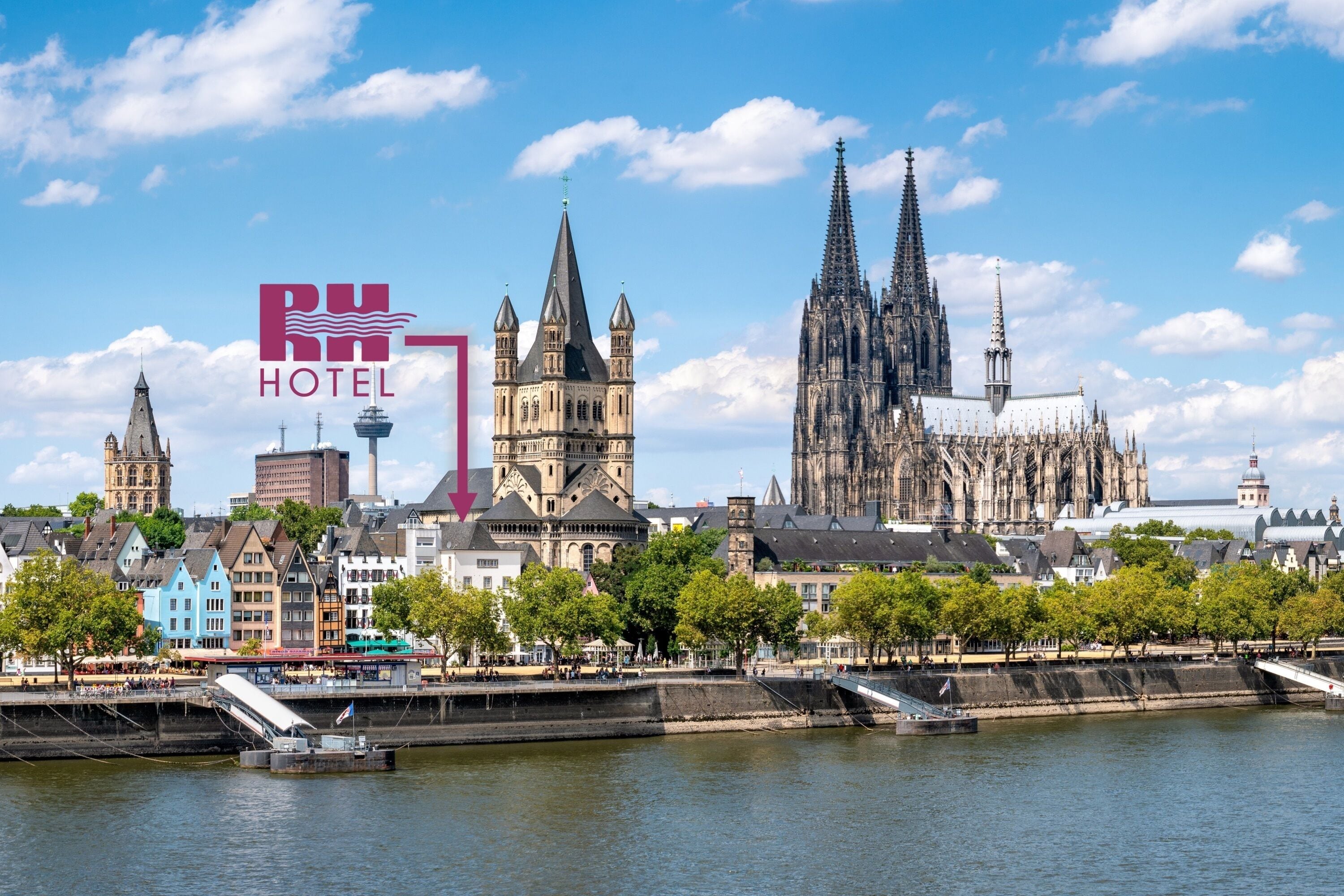 A cityscape with a prominent cathedral, a river, and a hotel sign.