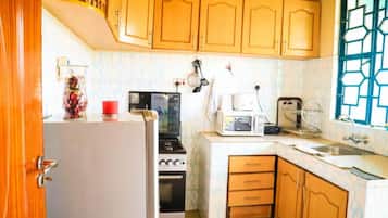 Fridge, microwave, cookware/dishes/utensils