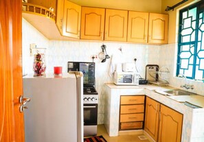 Fridge, microwave, cookware/dishes/utensils